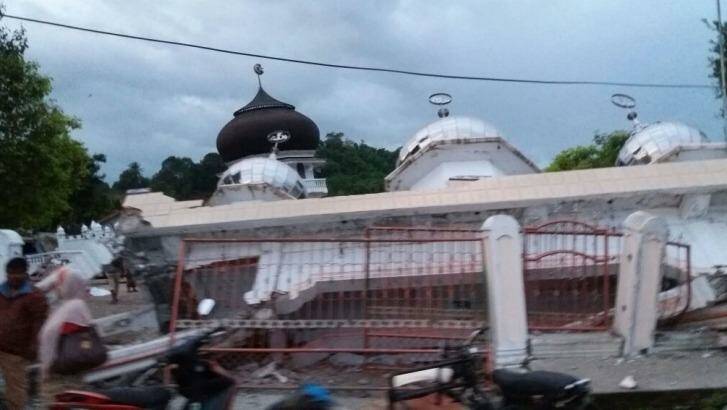 The National Agency for Disaster Management (BNPB) reported injuries and damage, including a crumpled mosque. Photo: BNPB/Twitter