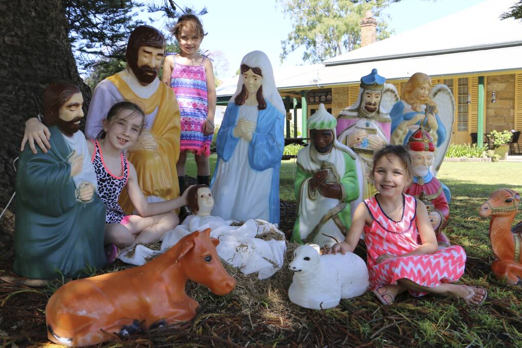 JESUS' BIRTH: The Boyes sisters - Annabelle, 7, Paige, 5, and Chloe, 5 - among the nativity scene at the Old Rectory in Raymond Terrace.Picture: Ellie-Marie Watts