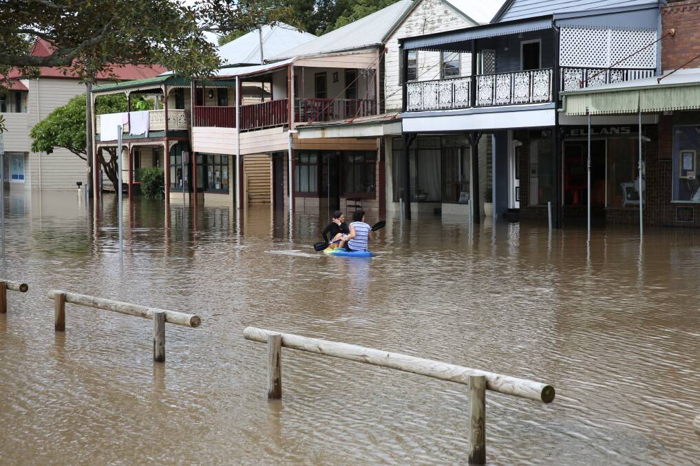 SNAPPED: Two women kayak down King Street on Wednesday. Picture: Stephen Wark.