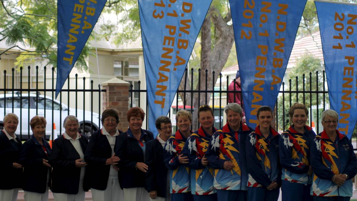 PENNANT STARS: Marie Mulheron, Virginia Moxey, Stella Strudwick, Helen Abbott, Gail Lewis, Loretta Bannister, Margaret Barnett, Deanne Price, Anne Thompson, Kelly Richards, Molly Wilton and Helen Stokes unfurled the Raymond Terrace Women's Bowling Club's grade one pennant flag last Tuesday. Picture by Robyn Lewis.