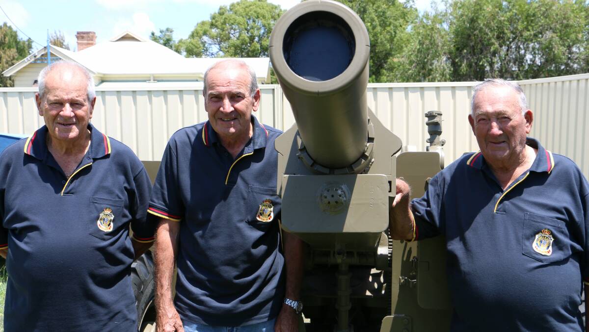 WELCOME: Barry Whiteman, Bruce Everitt and Edward Mowbray, at Tea Gardens Police Station, with the M2A2 Howitzer Gun. Picture: Stephen Wark.