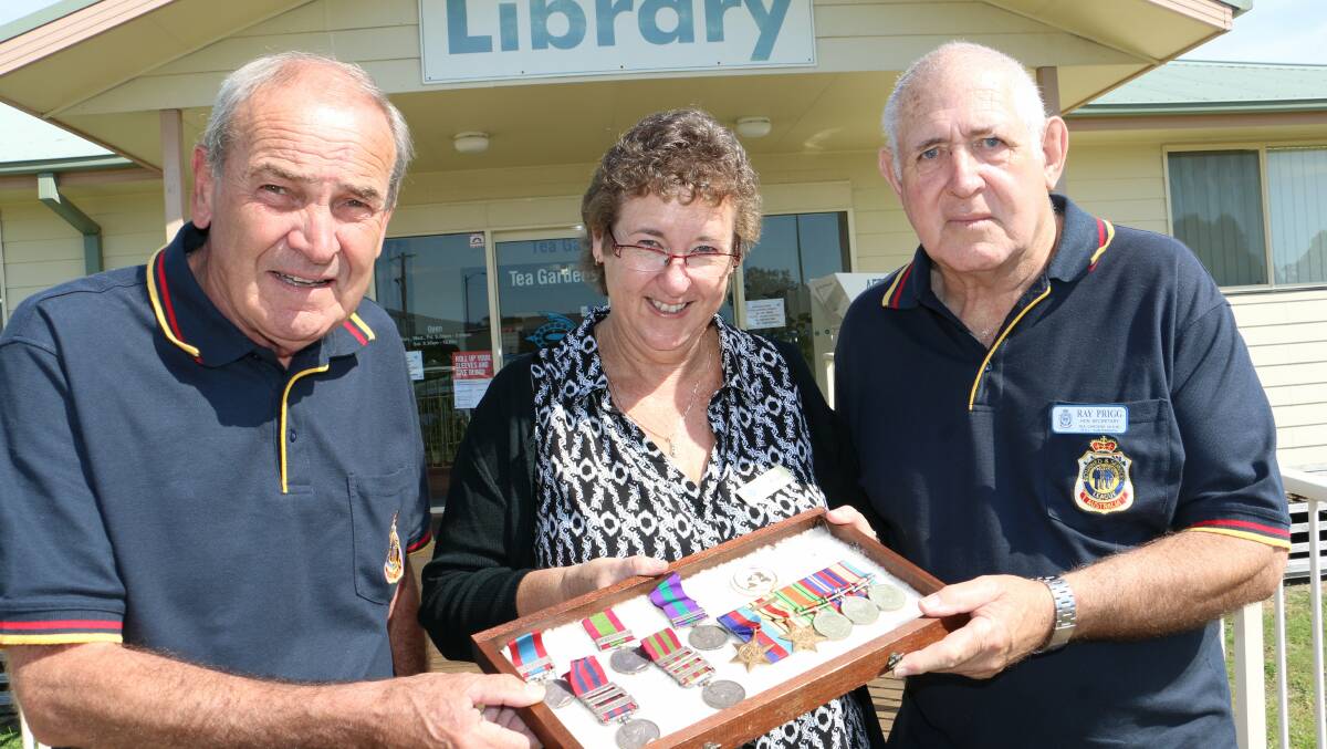 PLANNING: Bruce Everitt, Carol Johnson and Ray Prigg at Tea Gardens Library. Picture: Stephen Wark.