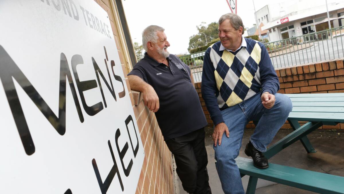 CHEERS: Frank Seysener from Raymond Terrace Men's Shed with Paterson MP Bob Baldwin. Mr Baldwin announced last week the shed had been successful in a grant to install a kitchen. Picture: Stephen Wark.