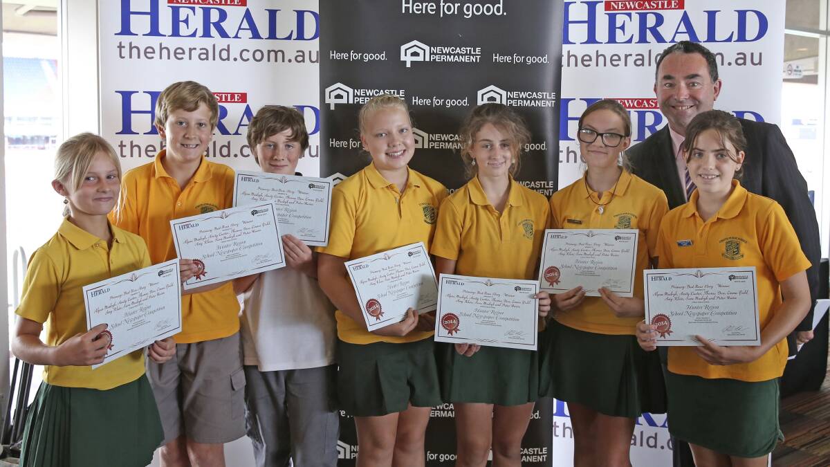 BEST: Alyssa Mudryk, Amity Carter, Thomas Dew, Emma Field, Amy Klein, Sara Mudryk and Peter Raine, who won two newspaper competition awards, with Newcastle Permanent CEO Terry Millet.