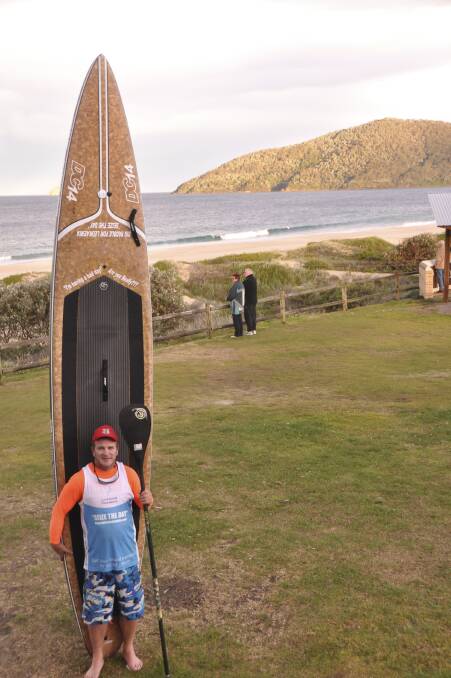 BLOOD BROTHER: Andy Owen, outside Tea Gardens Hawks Nest Surf Life Saving Club, after completing a 60kilometre paddle from Newcastle as part of a fund-raising initiative.  Picture: Sommer Owen