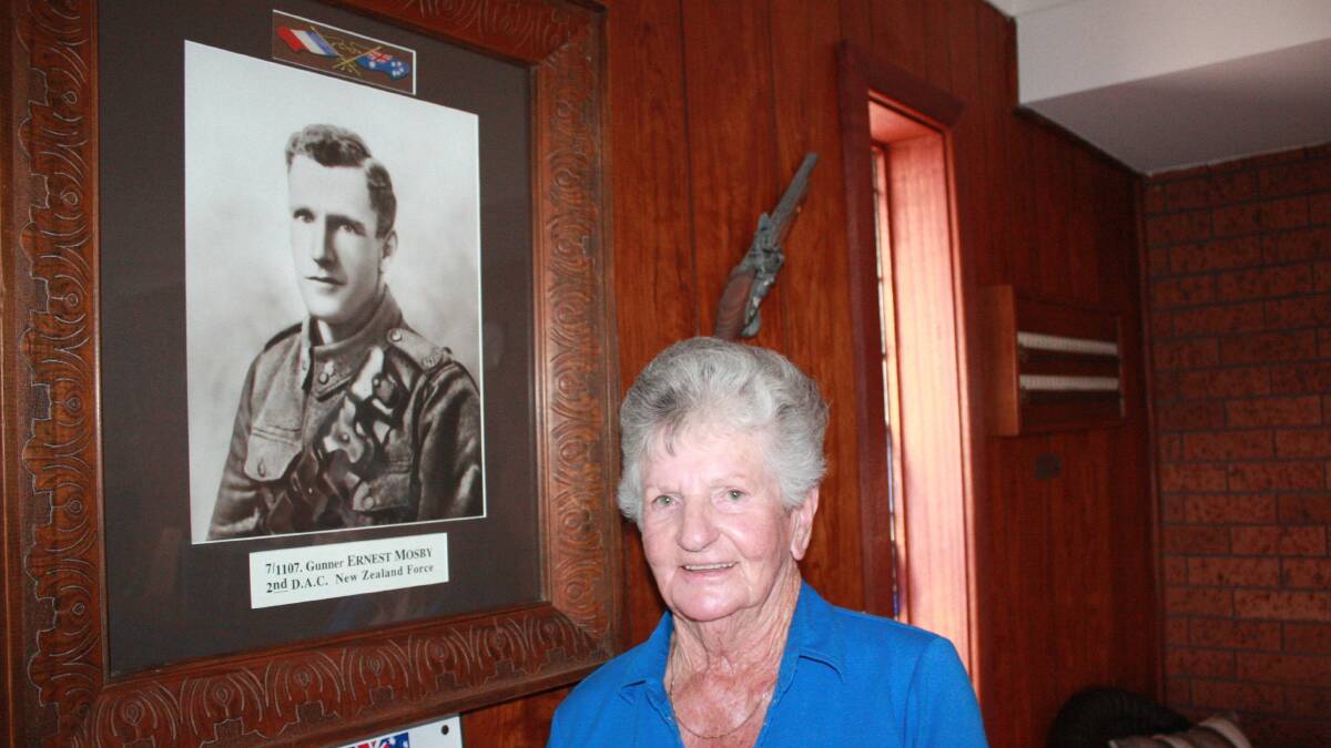 Betty Brock at her home in Birubi Point where a portait of her father Private Ernest Mosby hangs.