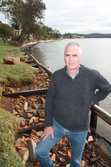 Port Stephens councillor John Nell at Kangaroo Point where there are 'illegal' structures built along the foreshore.