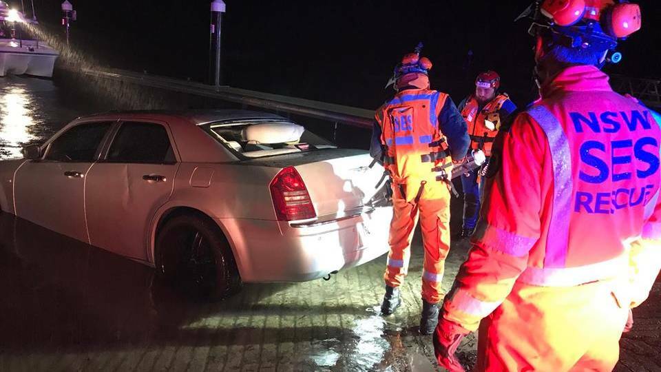 RESCUE: The car driven off the boat ramp at Lemon Tree Passage on Sunday. Picture: Port Stephens SES 