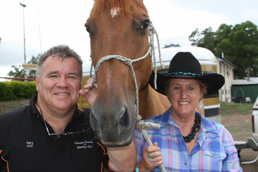RIDING HIGH: Gary Adams, Cody the horse and Ros Lindsay at Tomago Bowling and Sporting Club. Picture: Stephen Wark