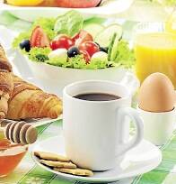 Breakfast including coffee, orange juice and vegetables groceries, food