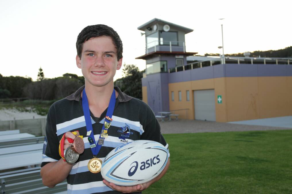 BEMEDALLED: Liam Kelly, 13, has won selection for NSW as both an athlete and rugby player. Picture: Stephen Wark