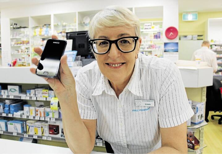 SWITCHED ON: Lana Tamindzic of Myall Pharmacy, Hawks Nest, recommends the app. Picture: Nathalie Craig