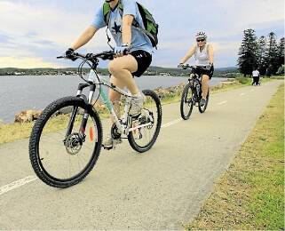 MAKING GROUND: Port Stephens Council aims to expand its shared pathway network by 136 kilometres. Pictured are cyclists at Speers Point, Lake Macquarie. Picture: Peter Stoop.
