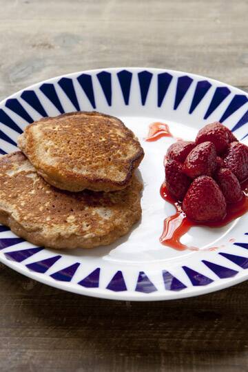 Oat pancakes with roast strawberries.. Frank Camorra BBQ recipes for Spectrum, The Sydney Morning Herald. Photographed by Marina Oliphant. Food preparation by Steve Rogers.