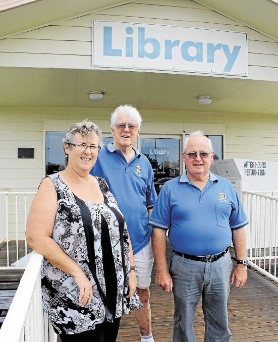 DONATION HELPS: Tea Gardens Library Officer Carol Johnson and Rotarian book sale administrators Ray Harrison and John Taylor. Picture: Nathalie Craig