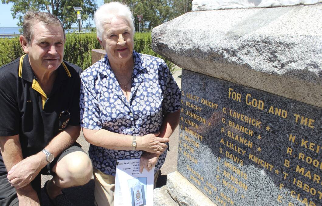 LABOUR OF LOVE: Benita Parker, from the Karuah Local History Research Group, and president of the Karuah RSL Sub-Branch Peter Fidden at the war memorial in Karuah. Picture: Nathalie Craig