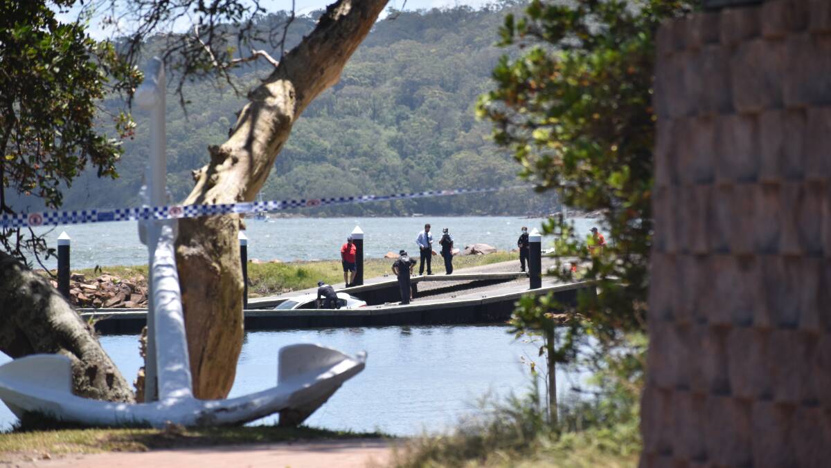 Two bodies have been recovered along with a hatchback from Soldiers Point boat ramp. Picture: Ethan Hamilton
