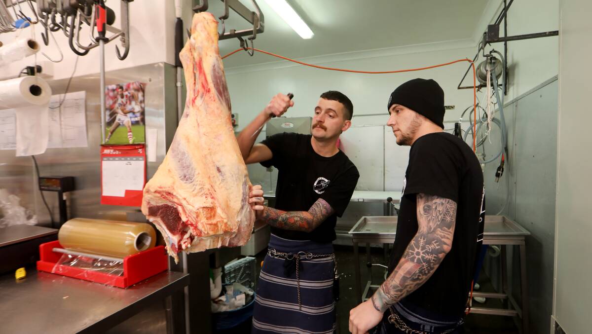Owner of Cleaver & Co Quality Meats Wollongong Lachy Kerr, left, with apprentice butcher Joshua Borg. Picture by Sylvia Liber