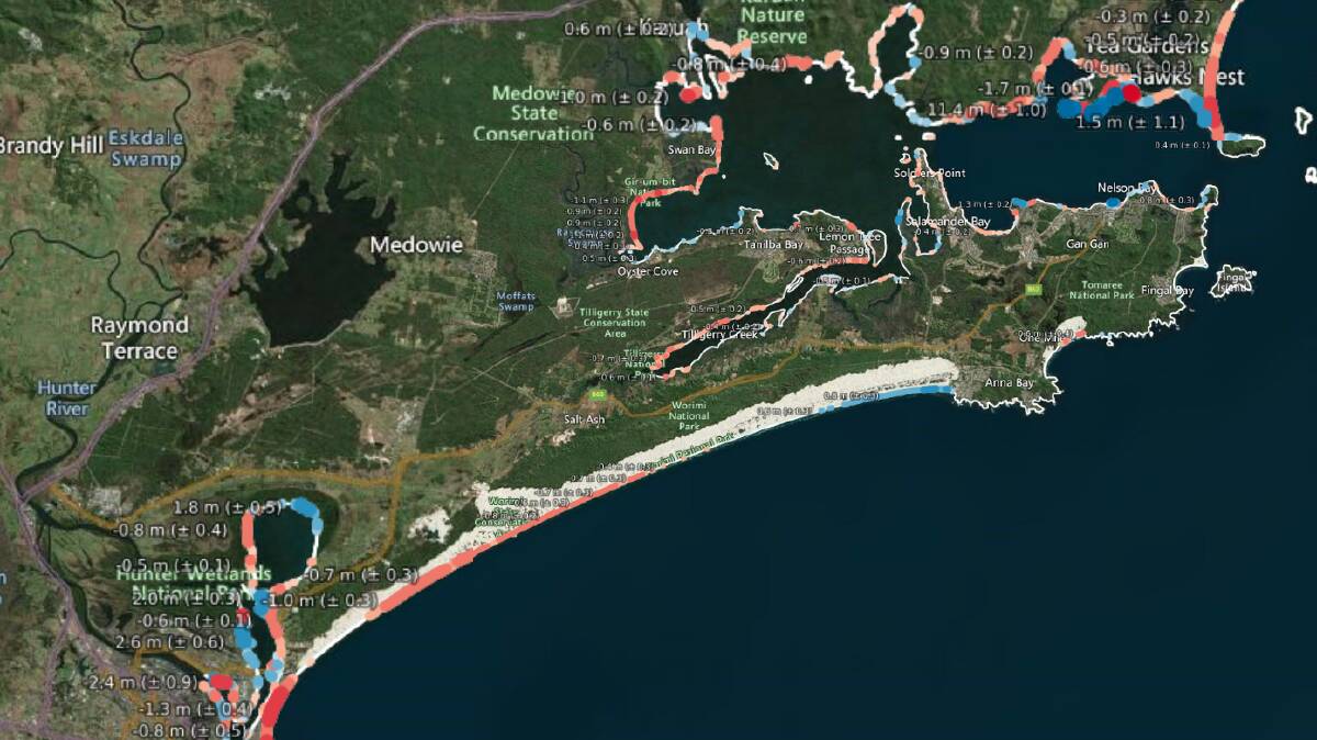 A still of the Digital Earth Australia interactive coastline map, which shows parts the coast has receded in red, parts it has grown in blue, and where it's stable in white. 