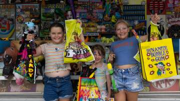 Sisters Alexis, Peyton and Lillyana Martin were happy with their showbag selections. 