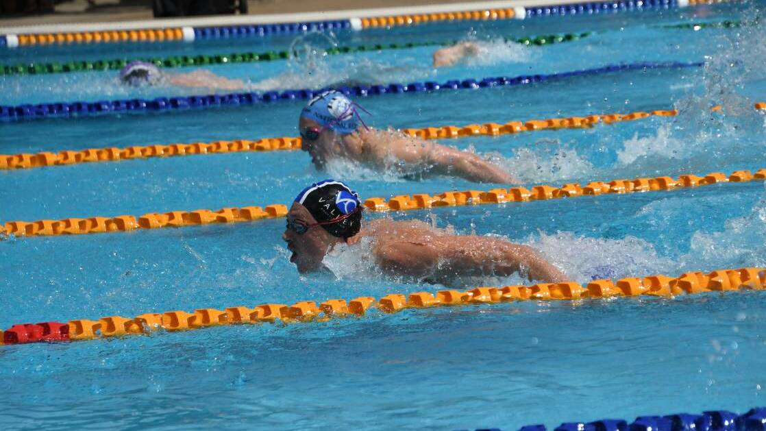 Valley Aquatic Club swimmer Reece Caddy leads the 16 and over 200m butterfly at the 2022 CVSA summer championship. Picture by Michael Hartshorn
