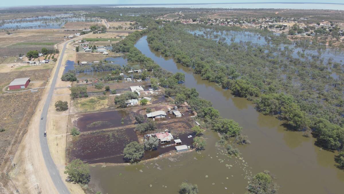 An aerial photo of homes along the Darling River in Menindee township inundated by floodwater. Picture by Water NSW