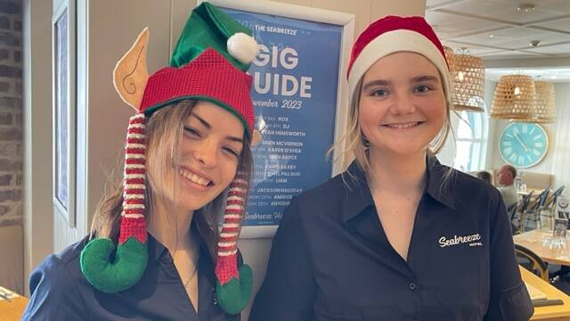 Seabreeze Hotel staff members Hannah Noonan (left) and Emily Busch (right) get into the Christmas spirit. Picture supplied
