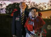 Nelson Bay RSL Sub-Branch welfare officers John Collins and Megan Ambrose at the war memorial in Apex Park following the dawn service last year. 