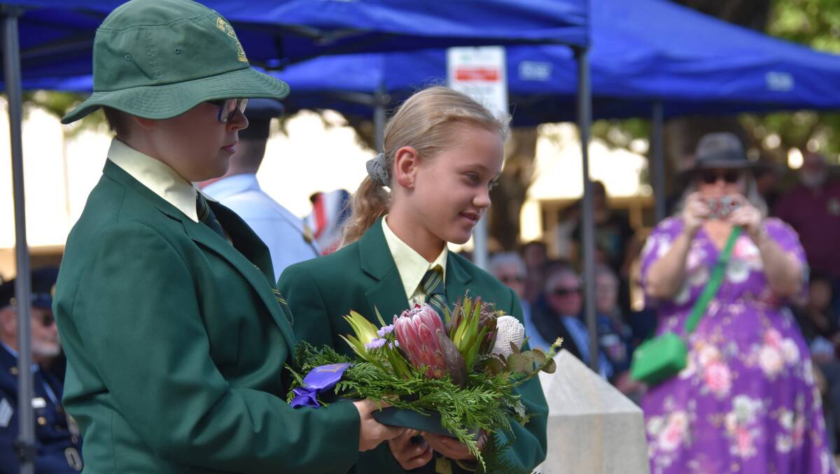 Record crowds gather at Raymond Terrace's Anzac Park to commemorate and reflect for Anzac Day. Pictures by Laura Rumbel