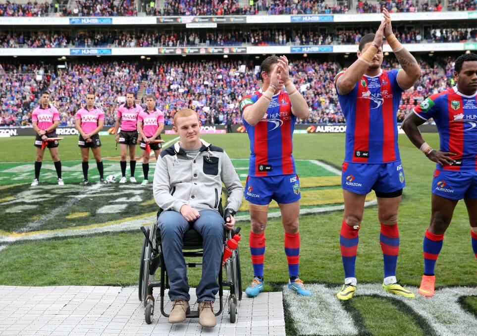 Alex McKinnon welcomed back to Hunter Stadium during the 2014 round 19 NRL clash between the Newcastle Knights and the Gold Coast Titans. (AAP Image/ Action Photographics, Grant Trouville)