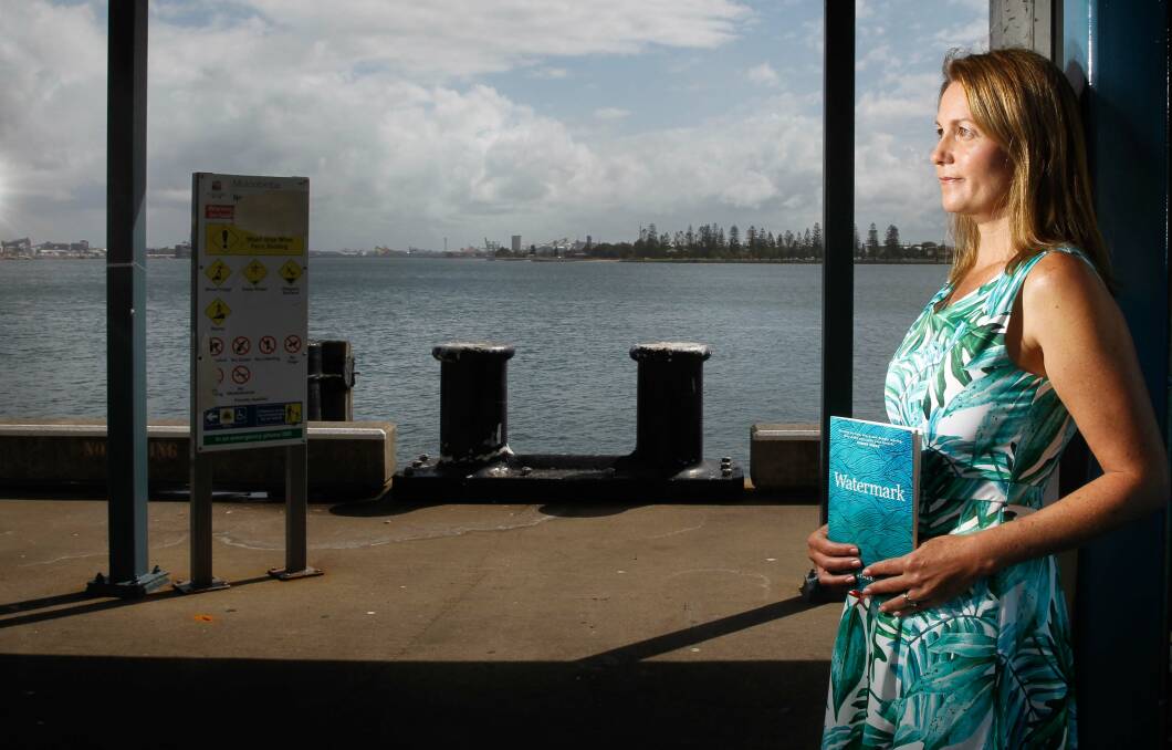 Coastal vision: Joanna Atherfold Finn, with her first book. Picture: Marina Neil