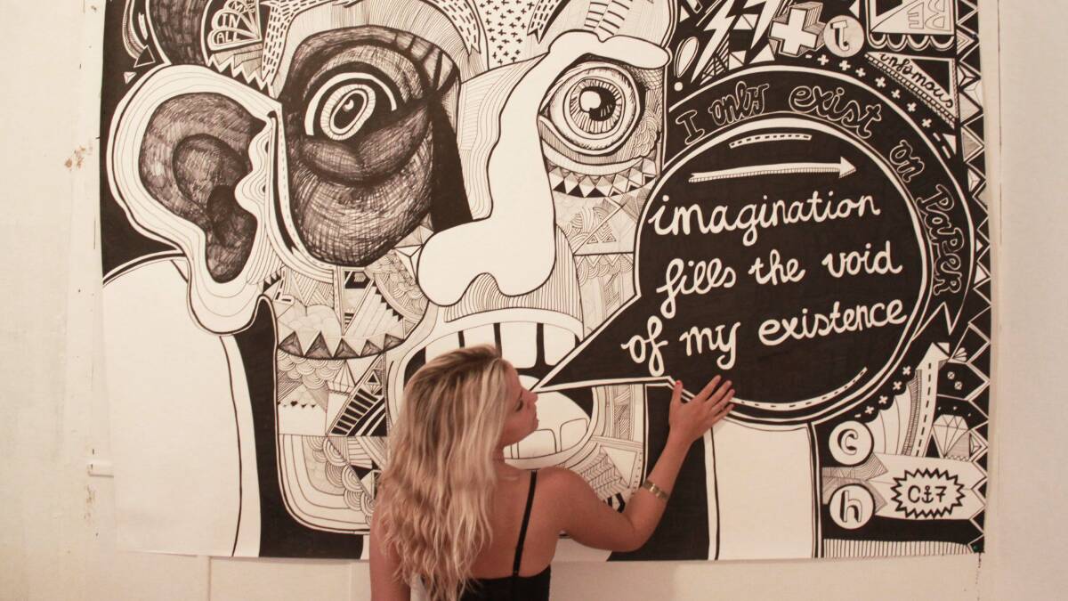 Mix n match: Port Stephens-based artist Chris Wigmans in front of one of her illustrations. Picture: Muse Photography