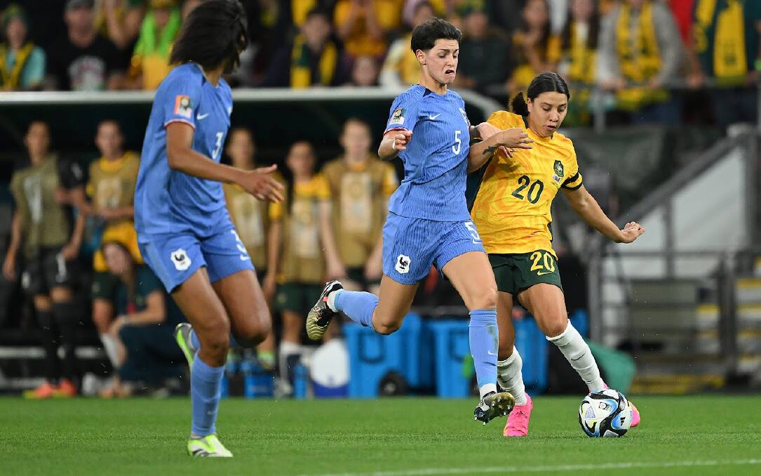 Matildas star Sam Kerr looks to get past her France opponent Élisa De Almeida during their Women's World Cup quarter-final at Suncorp Stadium on Saturday. Picture - Getty Images