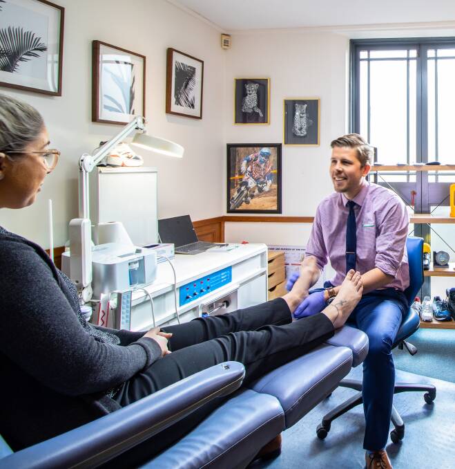 Stepping up: Podiatrist Ricky Lee ensures his patients are looking after their feet and maintaining good foot health practices.