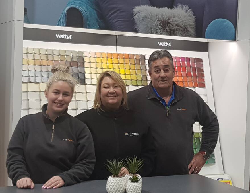 BRUSH WITH FAME: Paint team members, from left to right, Sharnee White, Tracy Barber and Alan Cox from H&D Timber and Hardware.