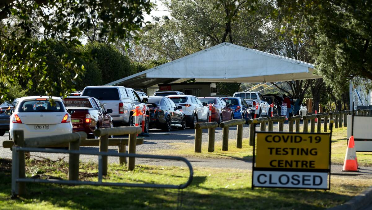 TEST: The queue at the East Maitland testing clinic on Wednesday afternoon. Picture: Jonathan Carroll