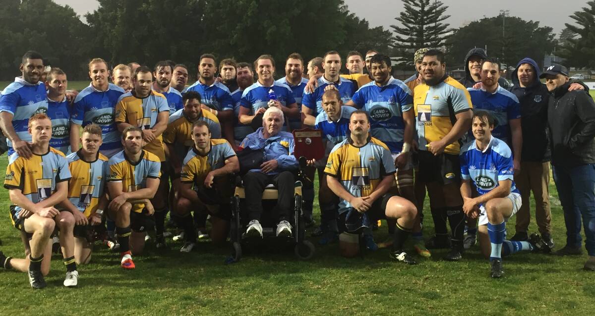 TRUE BLUE: Players from Southern Beaches and Wanderers with Tony Wansey after the Two Blues 24-20 victory at No.2 Sportsground. 