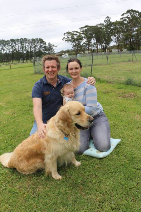 THANK-YOU: Dentist Victoria Lan with husband Gareth Morgan, 10-week-old baby Elodie and golden retriever Dexter at their Medowie home.
