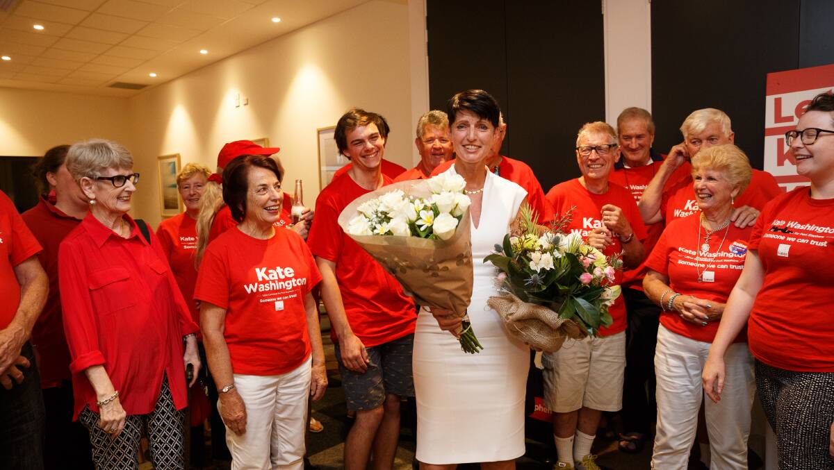 WIN: Labor's Kate Washington celebrates with supporters in Medowie after being re-elected as the Port Stephens MP. Picture: Max Mason-Hubers 