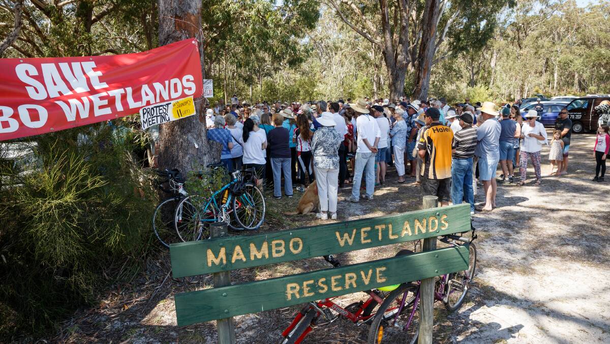 PROTEST: Community residents opposed to the sale of Mambo Wetlands at a previous rally. The Liberals have set the wheels in motion to compulsorily re-acquire the land.