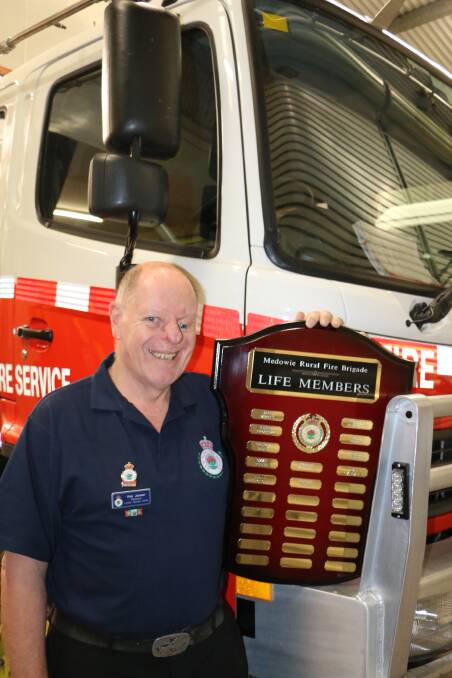 LIFE MEMBER: Rob Jansen makes the honour board for service at Medowie RFS.