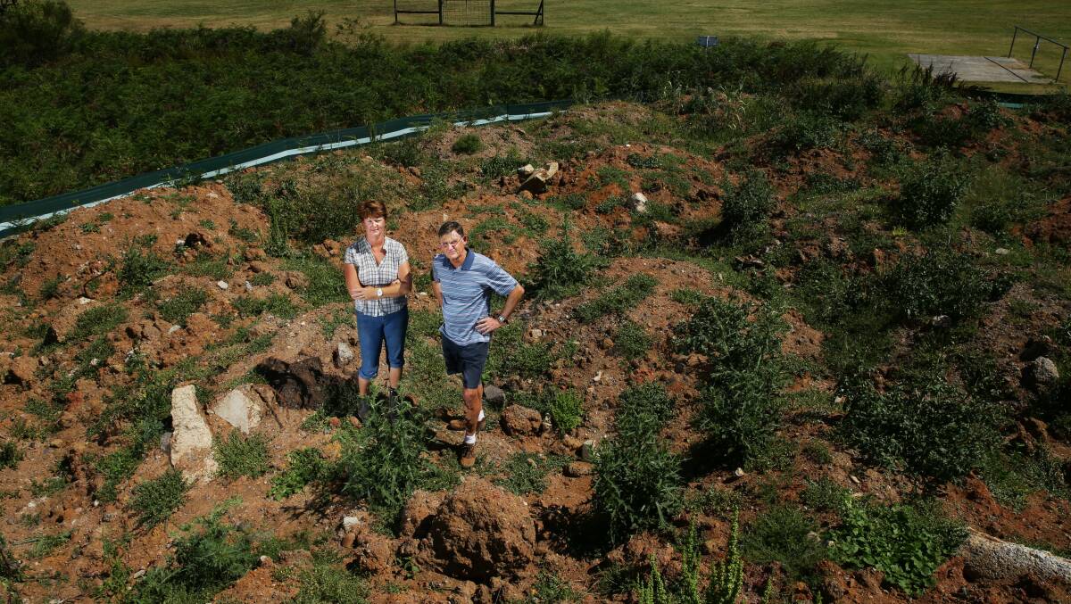 Salt Ash Pony Club president Lisa Gregory with Port Stephens councillor Geoff Dingle, standing on top of the dirt pile at Alexander Park. Picture: Max Mason-Hubers

