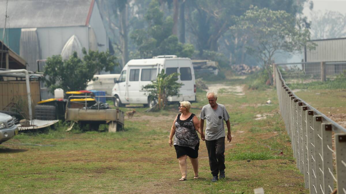 WATCHFUL: Campvale's Evelyn Reeves and Allan Wright were tense, as the fire burned less than a kilometre away. Picture: Jonathan Carroll 