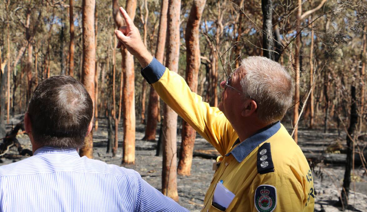 TOUR: Parliamentary Secretary for the Hunter Scot MacDonald MLC and NSW RFS Lower Hunter group officer at the site of some back burning earlier in the week. Picture: Sam Norris