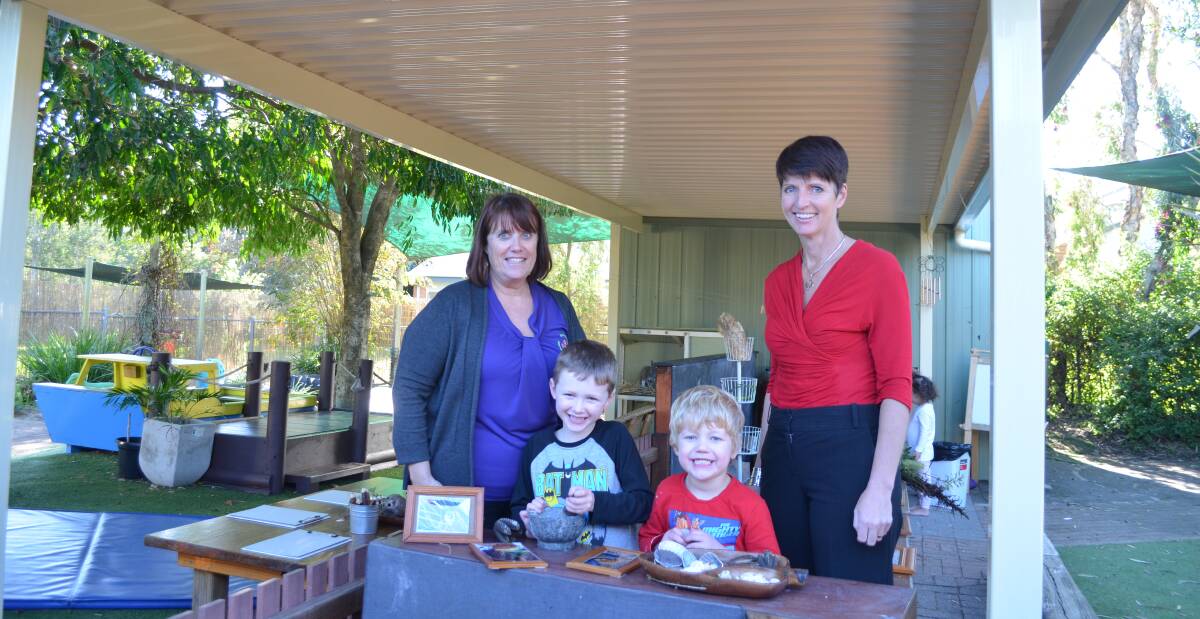 COVERED: Thomas Colbert, 5, and Ben Harrasti, 5, with centre director Mandy Moore and Port Stephens MP Kate Washington. Picture: Sam Norris