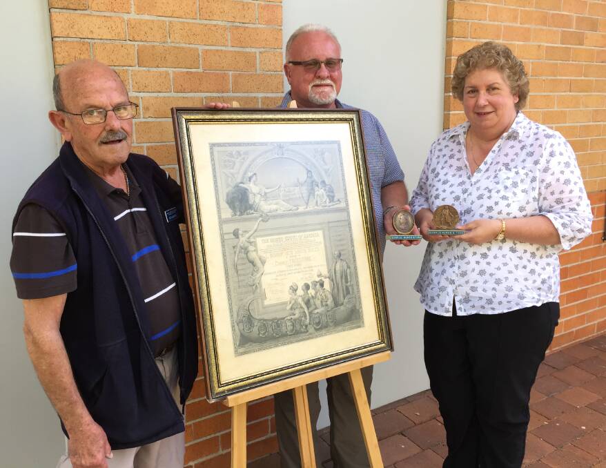 WHAT A JOURNEY: Raymond Terrace and District Historical Society president Ken Barlow and members John Gillam and Yvonne Fletcher. Picture: Sam Norris