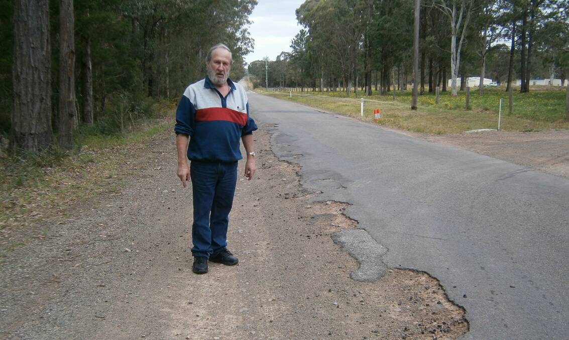 HARD YARDS: Resident Brian Harris pictured on Swan Bay Road in August 2017. He's campaigned for upgrades to the road for 30 years. Picture: Supplied