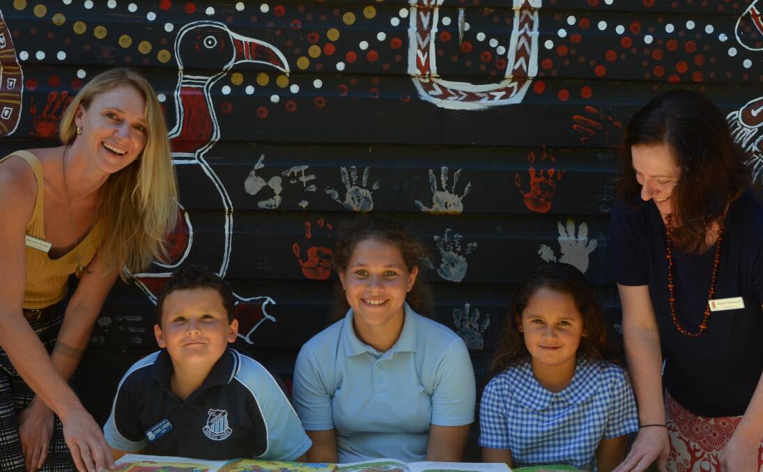 STAR PUPILS: The Smith Family project coordinator Danielle Tucker and project manager Alison Harwood, at Raymond Terrace Public School with captain Jayden Blackie, 11, Milahni Elemes, 10, and Tashaya Kelly, 8.