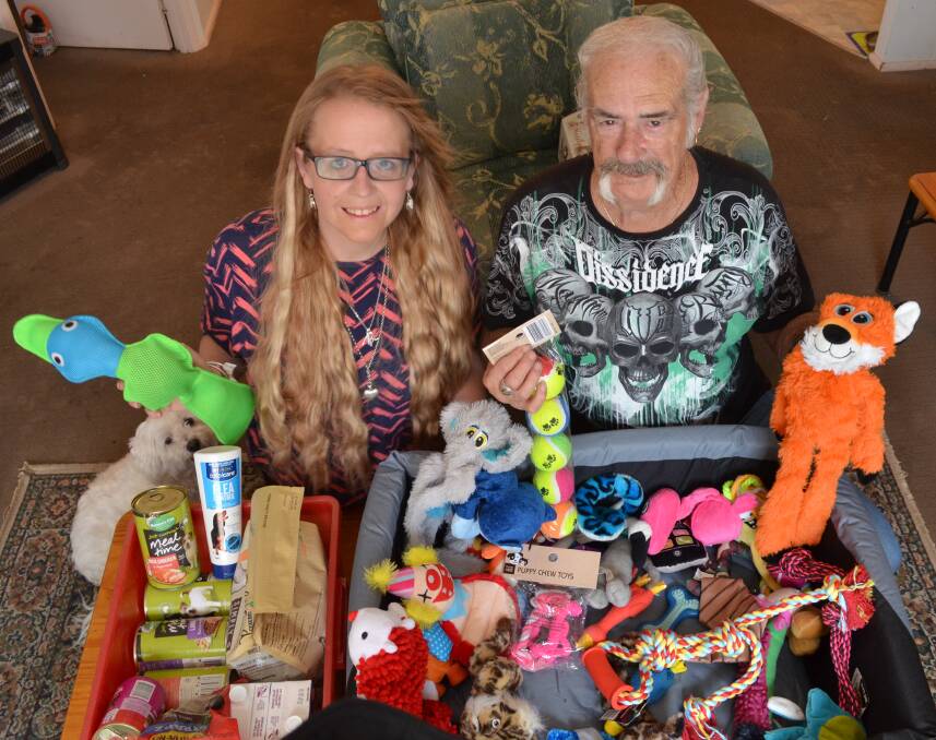 CLAUS FOR PAWS: Rachael Roberts and Neville McDemott have begun a collection for animals without a home this Christmas. Picture: Sam Norris