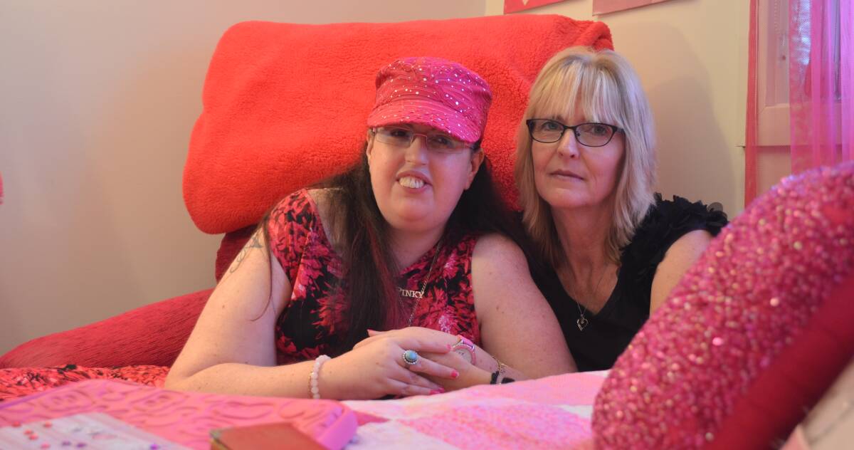GOING IT ALONE: Amy and her mum, Linda Bobeth, at their Raymond Terrace home. A sanctuary, dressed in pink, Amy's favourite colour. A love that's born the nickname "Pinky". Picture: Sam Norris